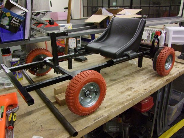 The frame is welded from 1” square steel tubing, the wheels were supposed to be for handtrucks, and the brakes were taken from the electric scooter parts bin.